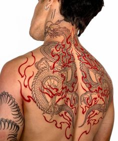 a man with dragon tattoos on his back