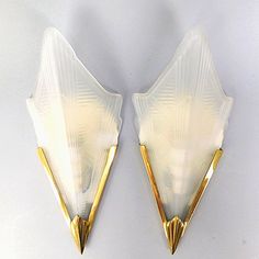 pair of sconces in the style of art deco