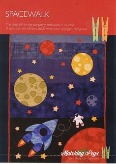 a quilted wall hanging with space and rockets on it