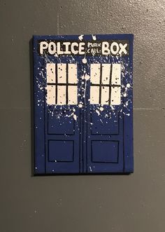 a blue police box painted on the side of a wall