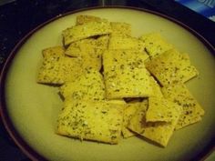 a plate full of crackers sitting on top of a table