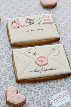 decorated cookies with envelopes and stamps on them