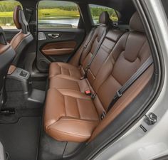 the interior of a car with brown leather seats