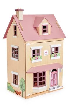 a wooden doll house with pink roof and windows on the front, sitting against a white background