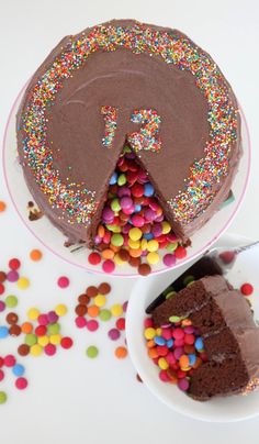 there is a chocolate cake with sprinkles on the plate next to it