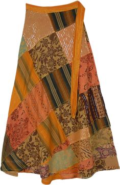 A beautiful citrus-colored wrap-around skirt - that reminds you of the sandstone and rocks you see in the grand canyon - is sure to make you feel confident and radiant.  The patterns are put together in an artistic fashion and the skirt is truly unique with patchwork with striped fabric and some with shiny tinsel, and yet others being floral. #tlb #WrapAroundSkirt #Patchwork #MaxiSkirt #Fall #Halloween #GypsyLongWrap Patchwork Skirt Pattern, Bridesmaids Outfits, Orange Clothing, Maxi Skirt Fall, Skirt Patchwork, Geeky Clothes, Floral Wrap Skirt, Artistic Fashion, Patchwork Clothing