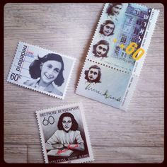 three postage stamps with pictures of women on them, one has a woman's face