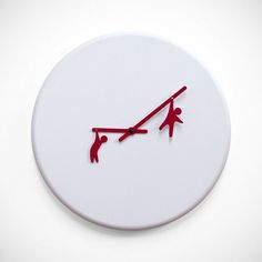 a white clock with red hands and two people on it's face, against a white background