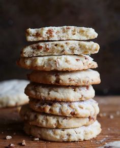 a stack of cookies sitting on top of a wooden table