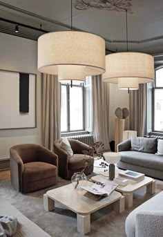 a living room filled with furniture and lamps