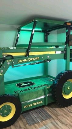 the john deere tractor is painted green and yellow