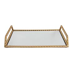 a gold metal tray with rope trimmings and a mirror on the bottom,