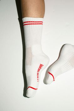 An extended version of the Girlfriend sock with a ribbed, striped cuff. Cozy, supportive and available in the best colors. Fabric is 85% Cotton, 13% Polyester, and 2% Spandex Winter Sporty Socks With Ribbed Cuffs, Sporty Winter Socks With Ribbed Cuffs, White Sporty Winter Socks, White Sporty Socks For Winter, White Ribbed Winter Socks, Sports Cotton Socks, Le Bon Shoppe Socks, White Cotton Sports Socks, Sporty White Fade-resistant Socks