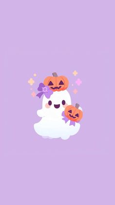 two pumpkins sitting on top of a ghost