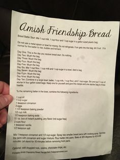 a person holding up a piece of paper with some writing on it that says, amish friendship bread