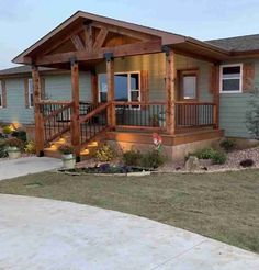 a small house with a porch and steps leading up to it