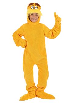 a child in a yellow cat costume standing with his hands up and smiling at the camera