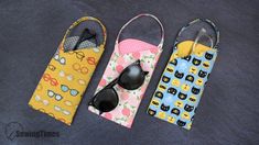 three glasses cases with sunglasses on them sitting next to each other