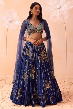 Blue lehenga with cutdana, sequin, bead embroidery in floral stripe pattern. Paired with sleeveless embroidered blouse and dupatta. - Aza Fashions Lehenga Designs Blue Colour, Lehenga Designs Sangeet, Sabyasachi Floral Lehenga, Floral Lehenga Blouse Designs, Embellished Blue Anarkali Pre-draped Saree, Blue Embellished Georgette Lehenga, Blue Sequined Pre-draped Saree, Designer Blue Choli With Sequins, Designer Blue Sequined Choli