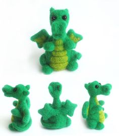 four small green stuffed animals sitting next to each other