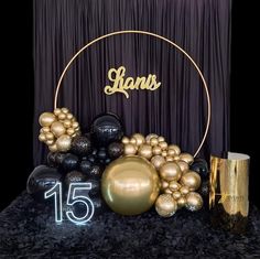 a table topped with balloons and decorations