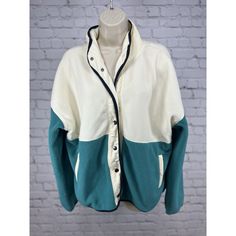 Stay Cozy And Stylish With This Herizon Campfire Cozy Fleece Jacket In Alexandrite. Made Of Polyester With A Colorblock Pattern, This Mid-Length Jacket Features Long Sleeves And A Collared Neckline With Button Closure. The Jacket Is Perfect For Travel, Casual Wear, Or Workwear. It Comes In A Cream/Teal Color Combination And Is A Regular Fit For Women In Size Xl. The Jacket Is Lightweight And Has Pockets For Convenience. It Is Suitable For Winter, Fall, And Spring Seasons. The Jacket Is Hand Wash Vintage Style Jacket, Teddy Jacket, Teal Color, Stay Cozy, Teal Colors, Color Combination, Campfire, Coats Jackets Women, Fleece Jacket