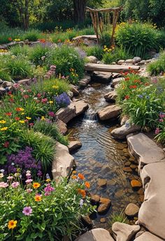 a stream running through a lush green forest filled with flowers