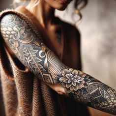 a woman with a tattoo on her arm