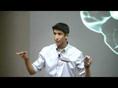 a man standing in front of a projection screen