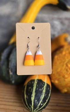 Check out these adorable candy corn shaped dangle earrings! They are perfect for any fall or Halloween festivities! The yellow, orange, and white stripes resemble the classic fall candy corn candies. They are lightweight with a stainless steel hook. They are 3D printed for optimal style and durability! Candy Corn Earrings, Fall Candy, Halloween Candy Corn, Fall Accessories, Halloween Earrings, Halloween Candy, Candy Corn, Favorite Jewelry, Jewelry Earrings Dangle