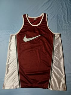 Very high quality OG Nike basketball jersey, Features #10 Lao on the back. Big swoosh print on the front is so cool too. Rare OG white tag. Approx. 24 X 35. Tagged XL. See pics for size and details! Vintage 1990s 90s Nike Air Big Swoosh Basketball Jersey, Lao #10 Burgundy XL Vintage Basketball Jerseys, Nike Basketball Jersey, Balls Shirt, Cold Fits, Vintage Sportswear, 90s Nike, Nike Brand, Basketball Shirts, Recycled Fashion