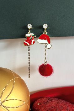 Santa Hat and Xmas Sock Dangle Enamel Christmas earrings , Christmas Dangle Earrings,Xmas Gift for her,Accessories for Xmas Parties **Festive Fun: Santa Hat & Stocking Dangling Earrings    Get into the holiday spirit with our **Santa Hat and Stocking Dangling Earrings 🎄🎉 These playful and festive accessories are perfect for adding a touch of Christmas magic to your look.   Featuring a cheerful Santa hat 🎅 and a colorful holiday stocking 🧦, these earrings are designed to swing with every movement, bringing a fun and lively vibe to your outfits. Lightweight and comfortable, they're ideal for wearing all day during your seasonal celebrations. 🎁❄️   Whether you're heading to a Christmas party 🎉, enjoying a cozy family dinner 🏡, or shopping for holiday gifts 🎀, these earrings are the pe Xmas Gifts For Her, Holiday Stocking, Holiday Stockings, Earrings Christmas, Seasonal Celebration, Christmas Earrings, Xmas Party, Dangling Earrings, Christmas Magic