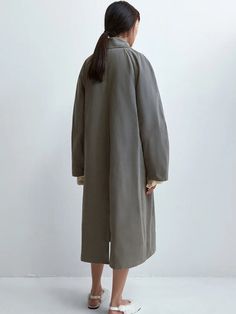 The Cordera Wax Cotton Trench in Taupe Grey is a unique and special rainy trench coat that is light and water repellent. Designed with a relaxed fit and long length, it's a perfect piece for the in-between season. Detailed with covered buttons and two ornamental pockets. 50% cotton / 39% polyester / 16% polyamide Hand wash or dry clean Made in Spain — Cordera, founded by sisters Mónica and María in 2008, has cultivated a distinct identity rooted in minimalism and ethical production practices. Ne Japanese Knitting, Galicia Spain, Knitting Machines, The In Between, Taupe Grey, Waxed Cotton, Covered Buttons, Long Length, Water Repellent