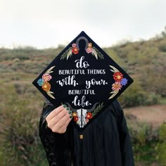 a person wearing a graduation cap that says, do beautiful things with your heart like