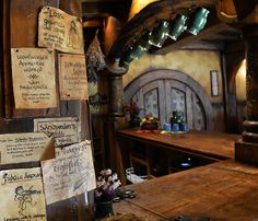 an old fashioned bar with lots of signs on the wall