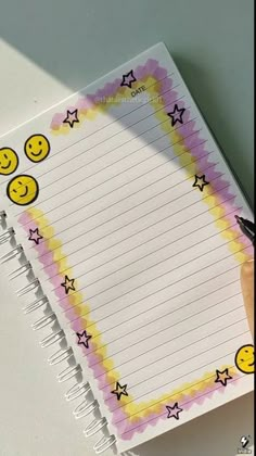 a notepad with smiley faces drawn on it