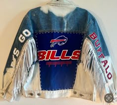 a buffalo bills jacket hanging on the wall