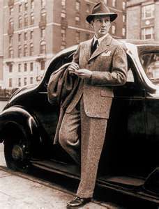 1940's Fashion | 1940's Fashion | Men's fashion in the 1940s An iconic men’s suit in the 1940s was the zoot suit. This suit was usually worn at unofficial ambiance and consisted of "an oversized jacket, wide lapels, broad shoulders, and the pants narrowed toward the ankles.” Edwardian Mens Fashion, 1940s Mens Fashion, 1940s Suit, Don Pedro, A Man In A Suit, Man In A Suit, Vintage Mens Fashion, 40s Fashion