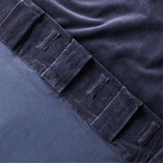 the back side of a pair of jeans with zippers and buttons on each side