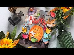 a table topped with lots of different types of flowers