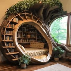 a living room with a tree shaped book shelf and couch in the center, surrounded by bookshelves