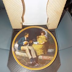 an old photo of a man and woman sitting on a bench playing the ukulele