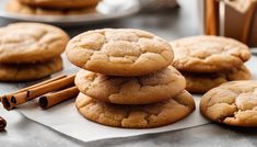 cookies stacked on top of each other with cinnamon sticks