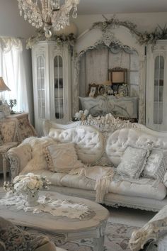 a living room filled with furniture and a chandelier