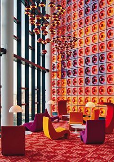 the lobby is decorated with colorful lights and modern furniture, as well as floor to ceiling windows