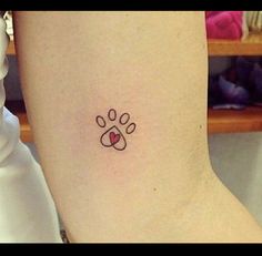 a dog paw with a heart tattoo on the ankle