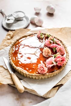 there is a pie with flowers on it