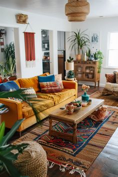 a living room filled with furniture and plants