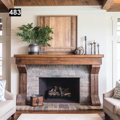 a living room filled with furniture and a fire place under a painting on the wall