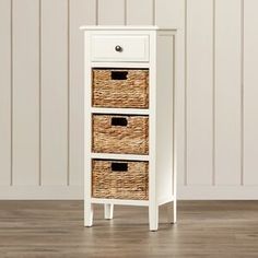 a white cabinet with three wicker baskets on it